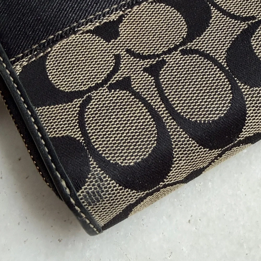Coach Legacy Signature C jacquard and leather wallet.